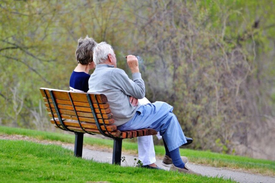 senior couple sitting on park bench in a discussio 2026 01 07 00 36 15 utc klein